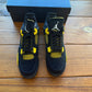 10.5 - Jordan 4 Retro 'Thunder' 2023 (GEBRAUCHT)